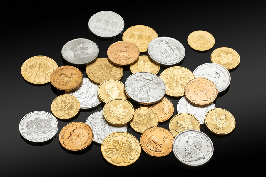 A pile of gold and silver bullion coins at Denver Aurora coin dealer shop