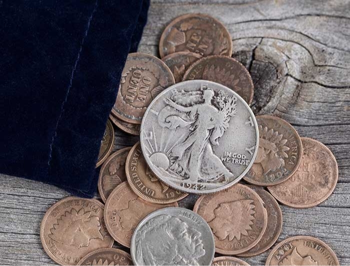 A pile of rare coins spilling out of a bag