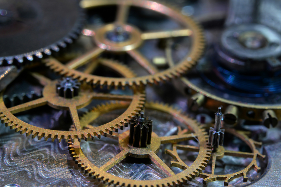 An exposed watch movement in a pocket watch being appraised for sale in Denver